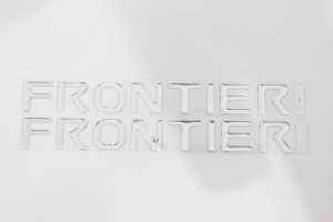 Emblema 'Frontier' Frontier (Lateral) Santo Antonio Cromado (Resinado)