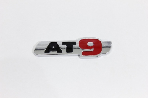 Emblema "at9" Toro 16/... Cromado