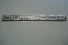 Emblema 'Outdoor' L200 Pajero Outdoor (Vazado)